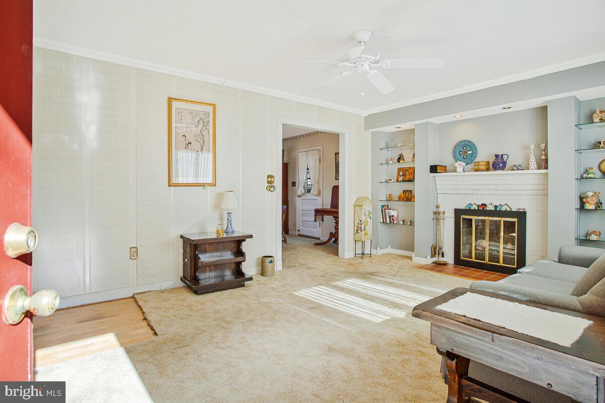 612 Fairmount Road Linthicum Heights, MD 21090 - Photo 4 of 46 a bedroom with furniture and a fireplace