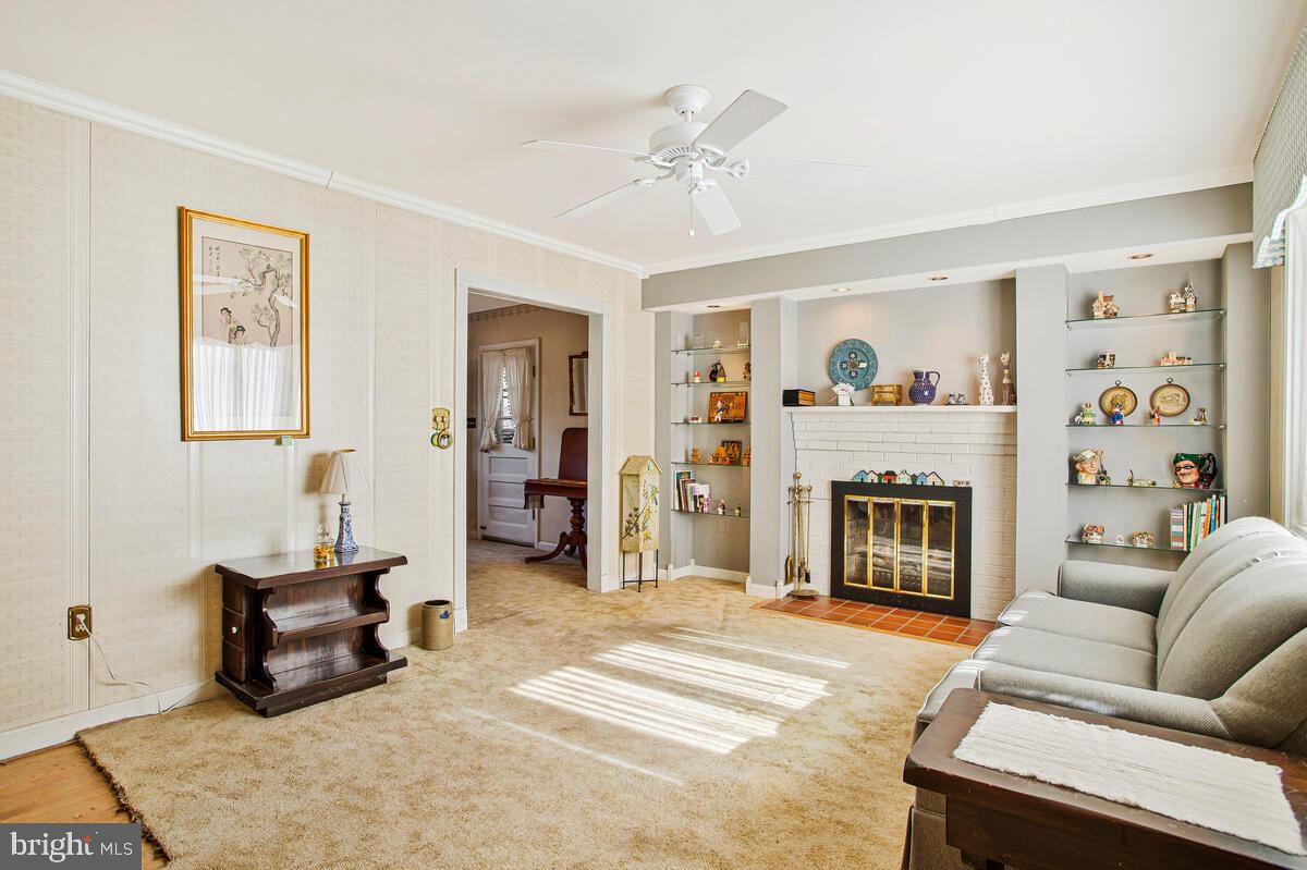 612 Fairmount Road Linthicum Heights, MD 21090 - Photo 5 of 46 a living room with furniture and a fireplace