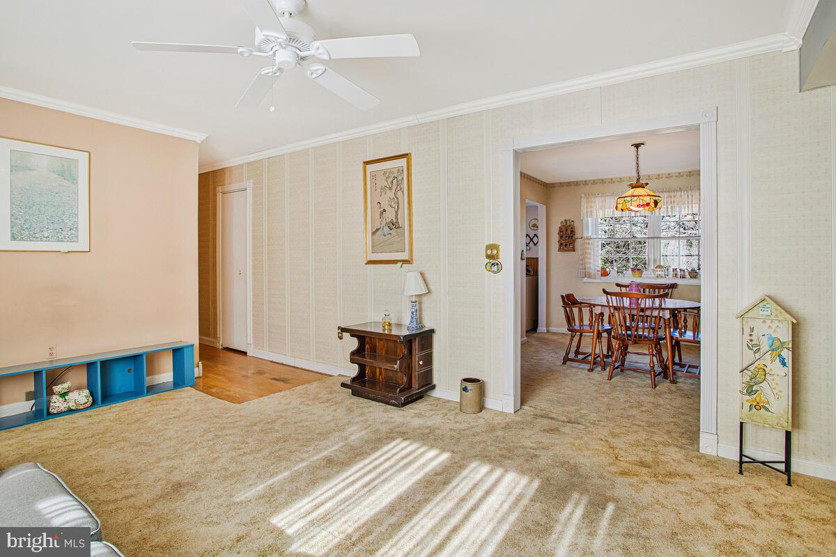 612 Fairmount Road Linthicum Heights, MD 21090 - Photo 8 of 46 a bedroom with a bed and a chandelier