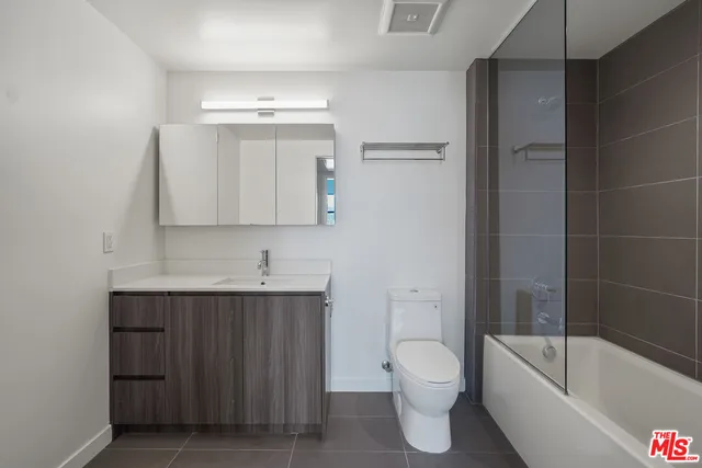 a bathroom with a toilet a sink and bathtub