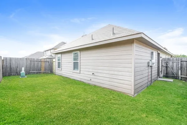 a view of a backyard with a garden