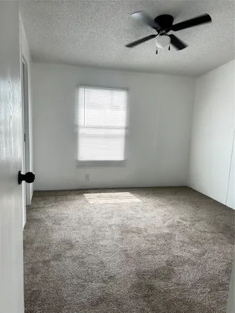 an empty room with a empty space and windows