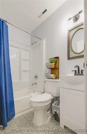 a bathroom with a toilet a sink and a bathtub