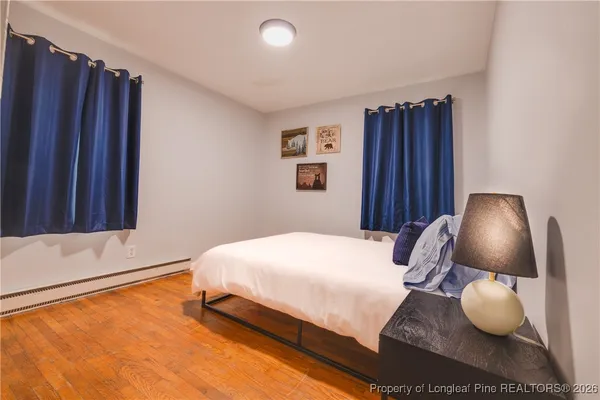 a bedroom with a bed and cabinets