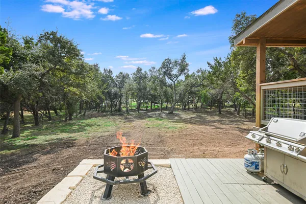a view of outdoor space with deck and yard