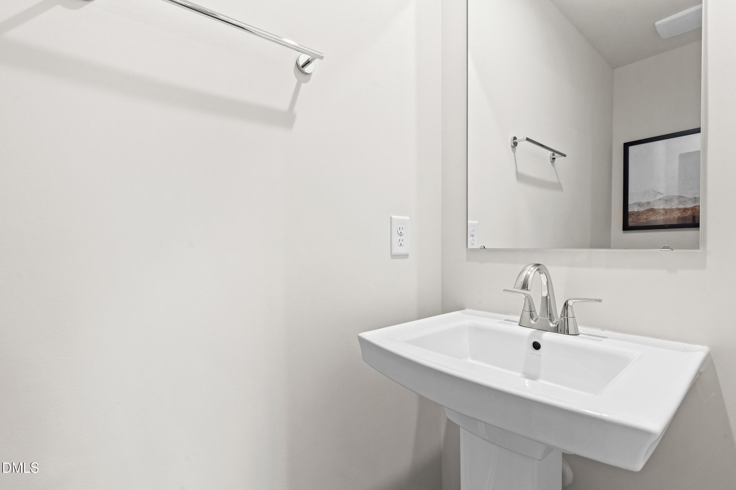 217 Rosewood Drive Sanford, NC 27330 - Photo 13 of 29 a bathroom with a sink and a mirror