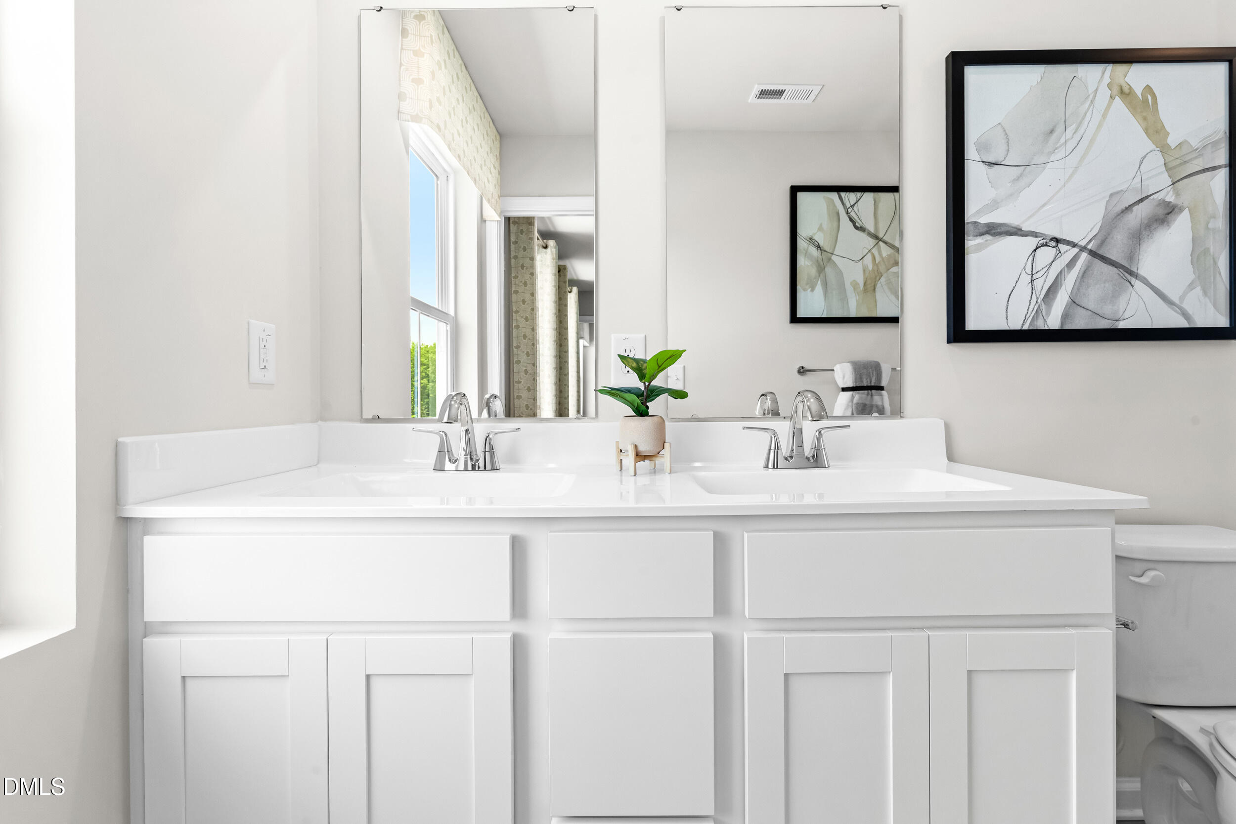 217 Rosewood Drive Sanford, NC 27330 - Photo 19 of 29 a bathroom with a sink and a mirror