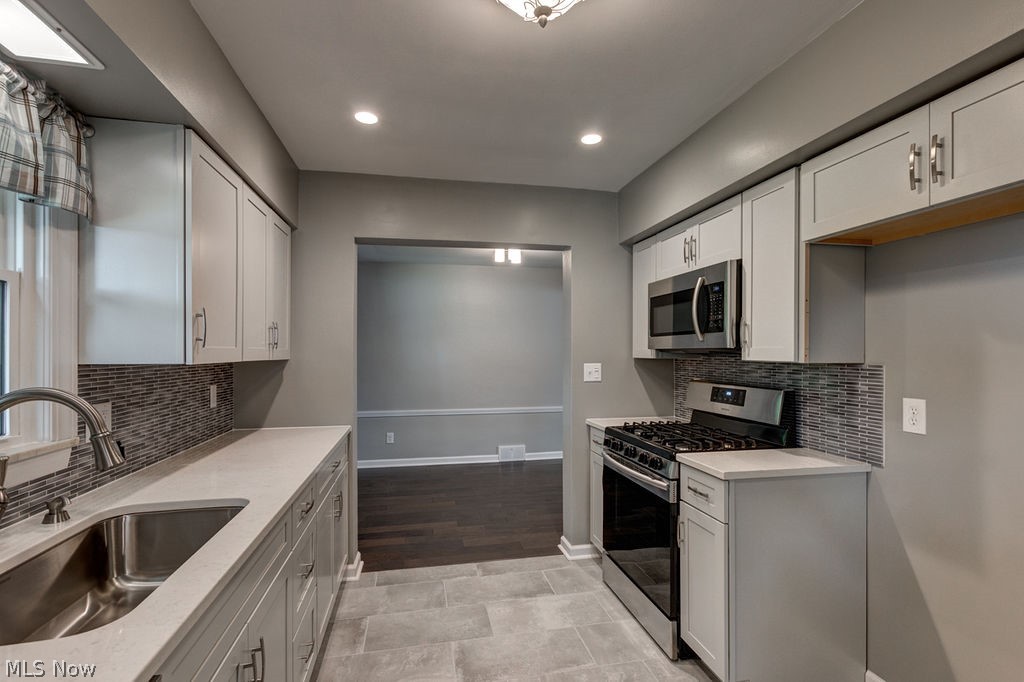 29005 Ridge Road Wickliffe, OH 44092 - Photo 11 of 31 New lighting fixtures accent the modern tone of the home.