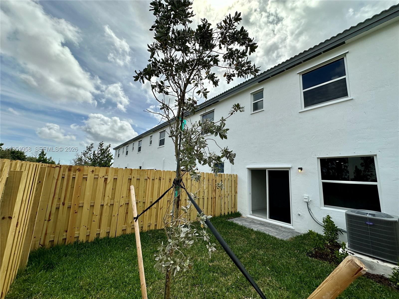 29229 Southwest 162nd Court Homestead, FL 33033 - Photo 11 of 27 a backyard of a house with lots of green space