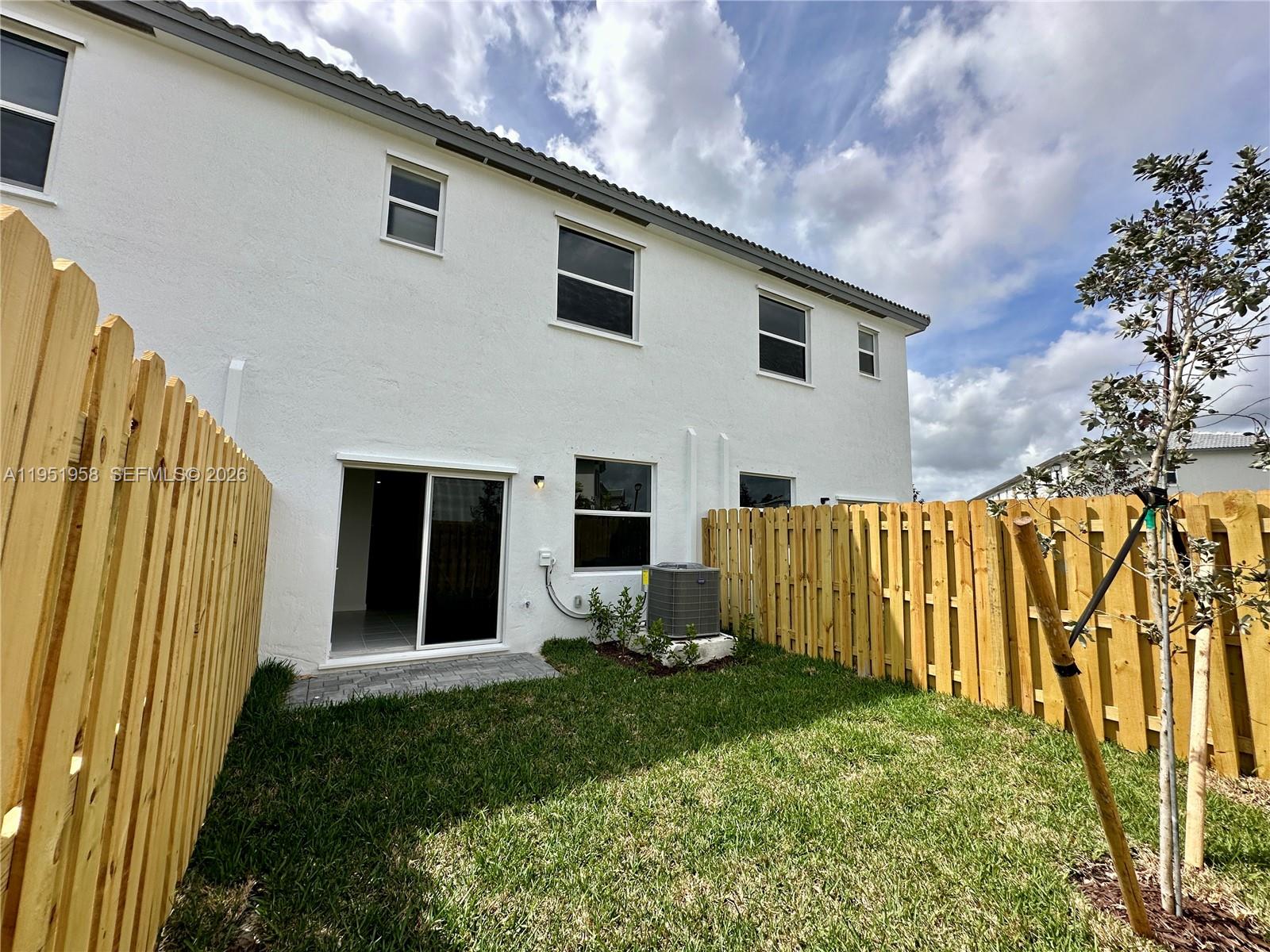 29229 Southwest 162nd Court Homestead, FL 33033 - Photo 12 of 27 a backyard of a house with garden and plants