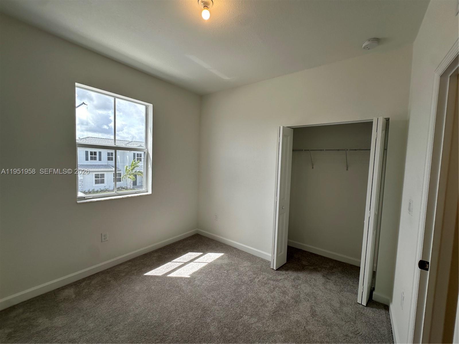 29229 Southwest 162nd Court Homestead, FL 33033 - Photo 17 of 27 an empty room with windows