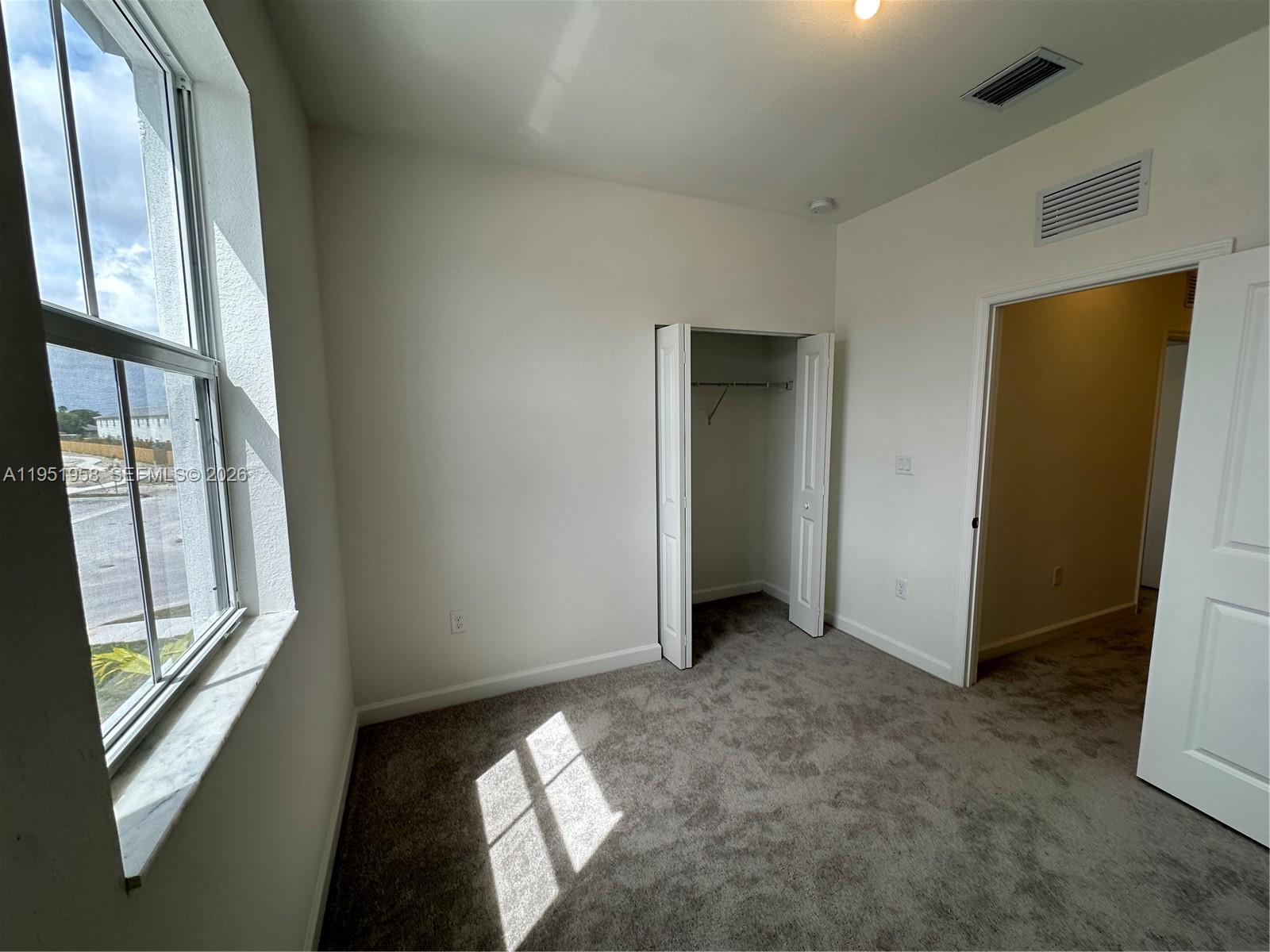 29229 Southwest 162nd Court Homestead, FL 33033 - Photo 18 of 27 a view of an empty room and window