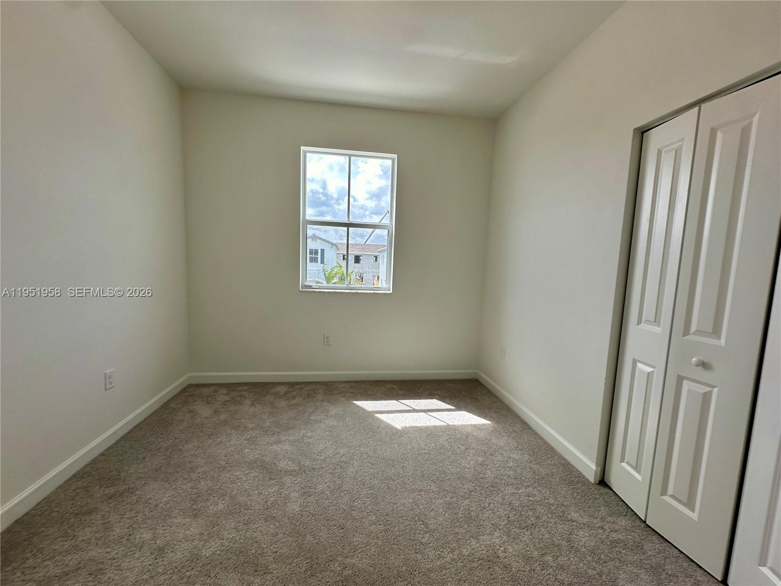 29229 Southwest 162nd Court Homestead, FL 33033 - Photo 24 of 27 an empty room with windows