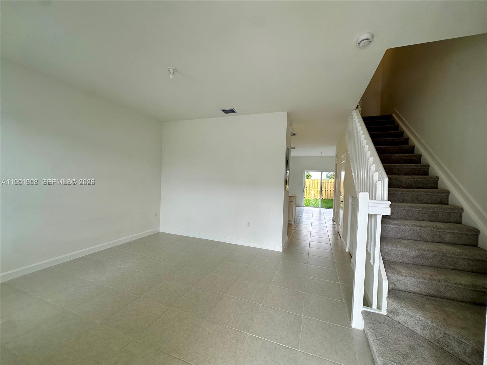 29229 Southwest 162nd Court Homestead, FL 33033 - Photo 3 of 27 a view of entryway and hall with wooden floor