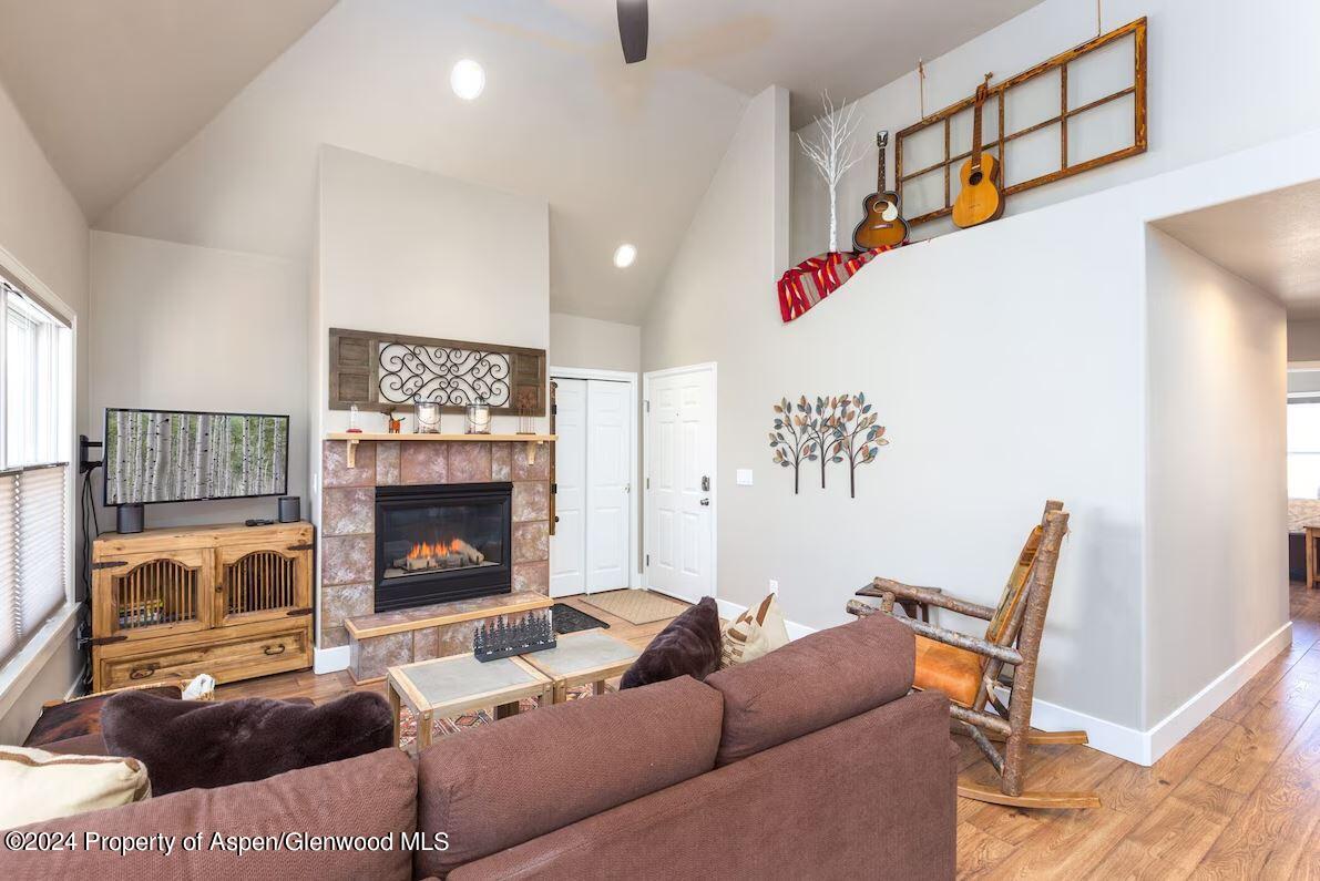 855 Gold Rivers Court, Unit 21D Basalt, CO 81621 - Photo 7 of 12 a living room with furniture and a fireplace
