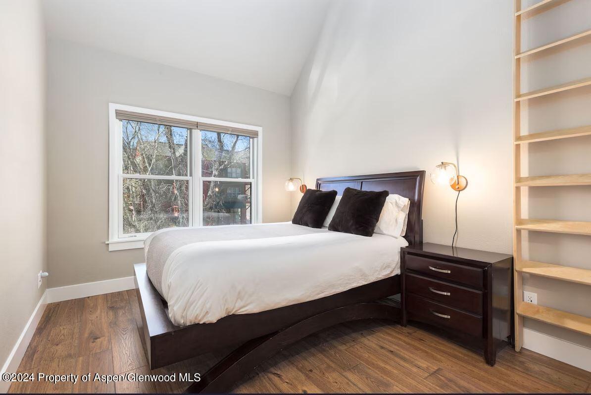 855 Gold Rivers Court, Unit 21D Basalt, CO 81621 - Photo 8 of 12 a bedroom with a bed and a window