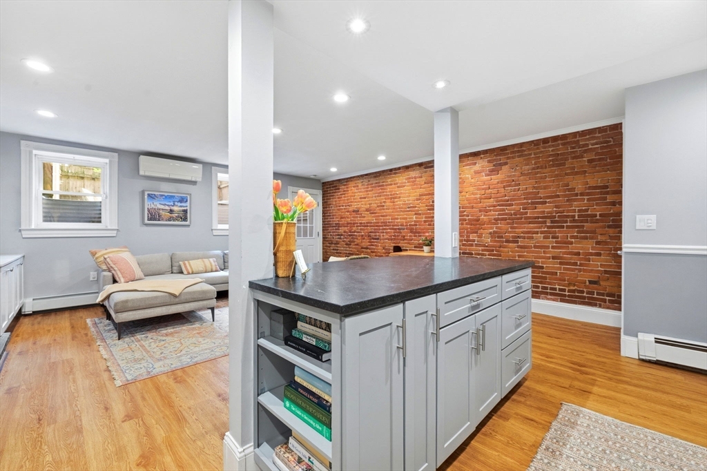 35 High Street, Unit 1 Boston, MA 02129 - Photo 25 of 33 a kitchen with stainless steel appliances granite countertop a stove and a view of living room
