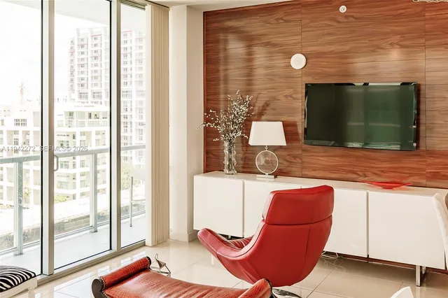 a living room with a sink furniture and a fireplace