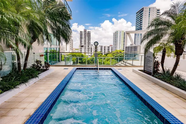 a view of a backyard with sitting area