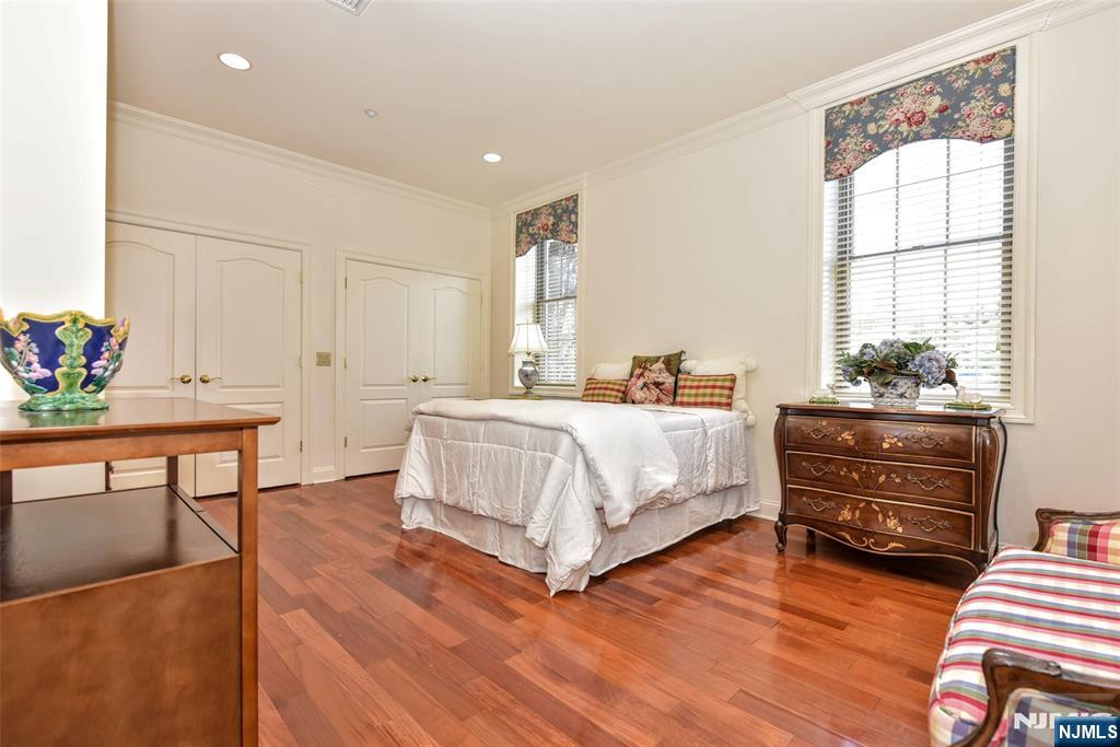 4201 Rio Vista Drive, Unit 4201 Mahwah, NJ 07430 - Photo 13 of 34 a bedroom with furniture and a wooden floor