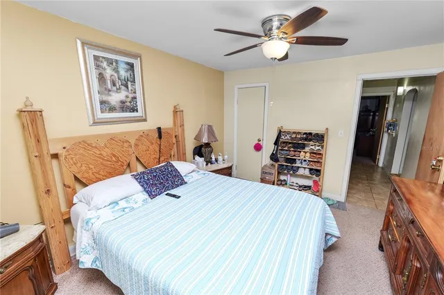 a bedroom with bed and window