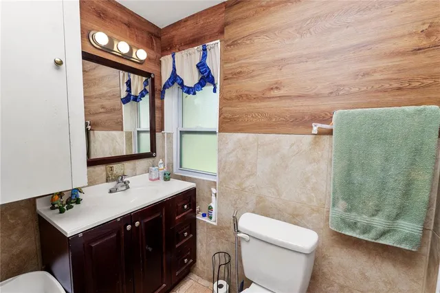 a view of walk in closet with clothes