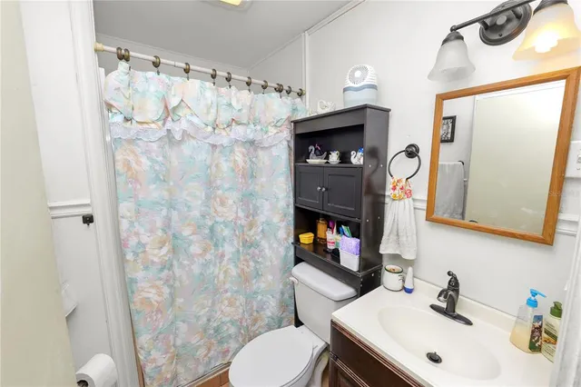 a living room with furniture a rug and a window