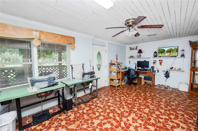 a living room with a rug and a table