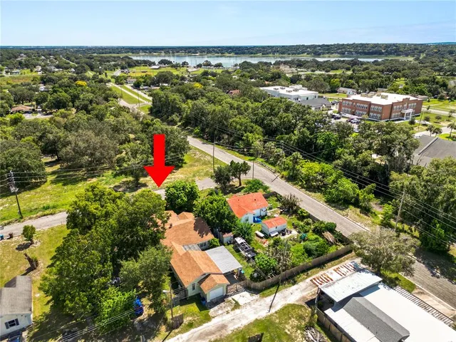 an aerial view of residential houses and outdoor space