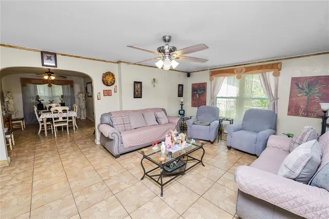 a large white kitchen with stainless steel appliances granite countertop lots of counter top space