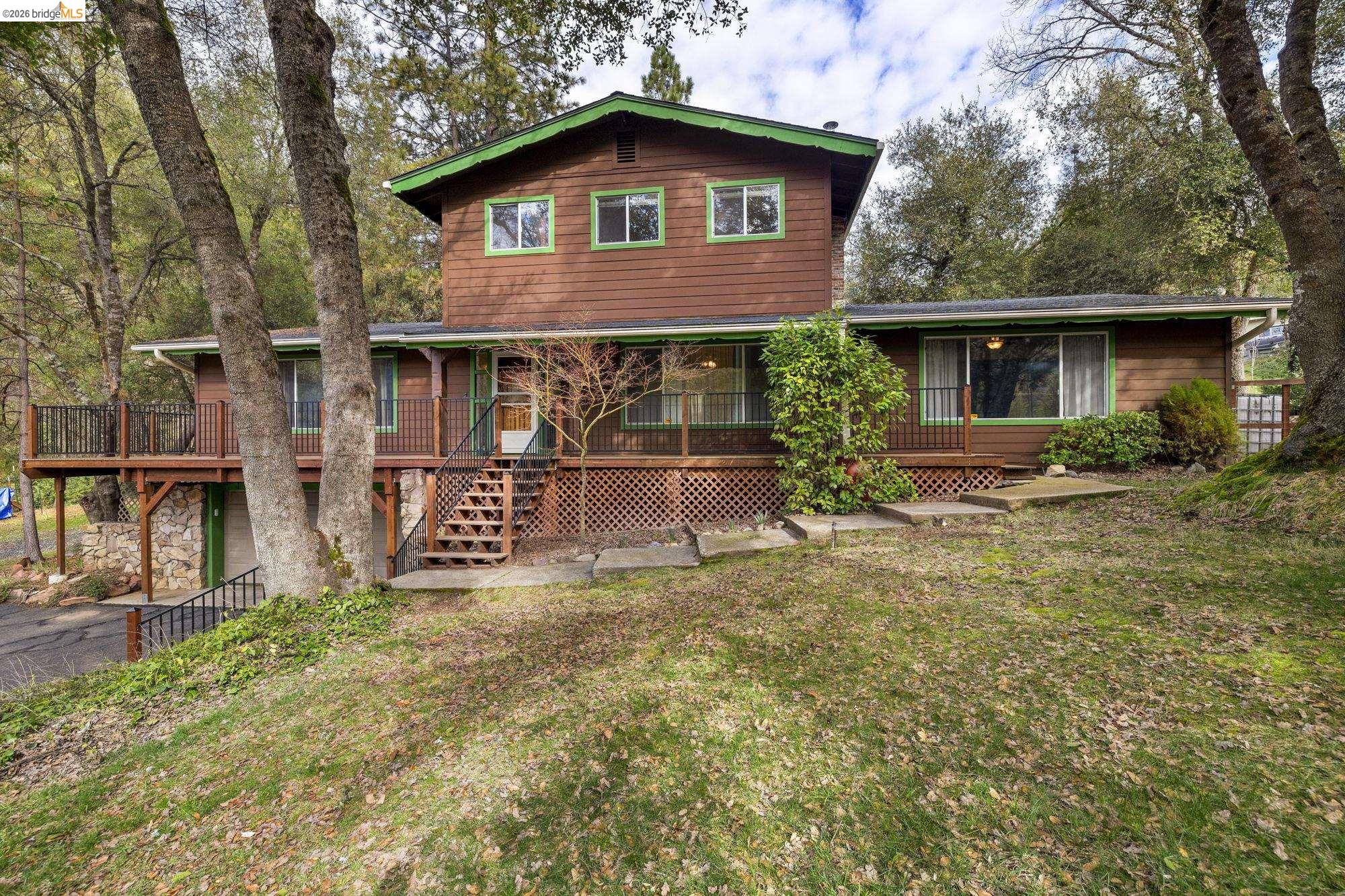 21550 Phoenix Lake Road Sonora, CA 95370 - Photo 1 of 50 front view of a house with a yard