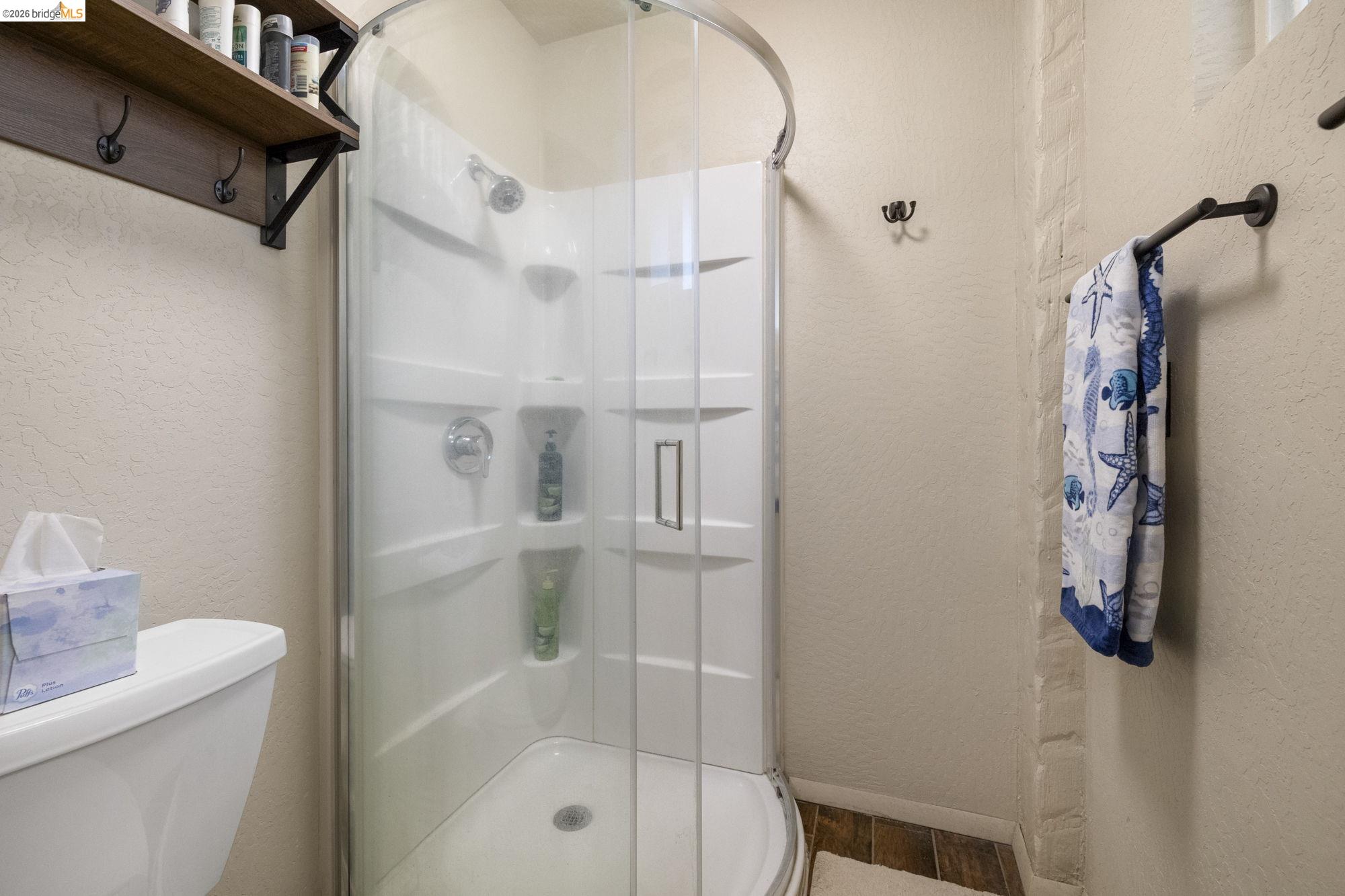 21550 Phoenix Lake Road Sonora, CA 95370 - Photo 23 of 50 a bathroom with a shower and a toilet