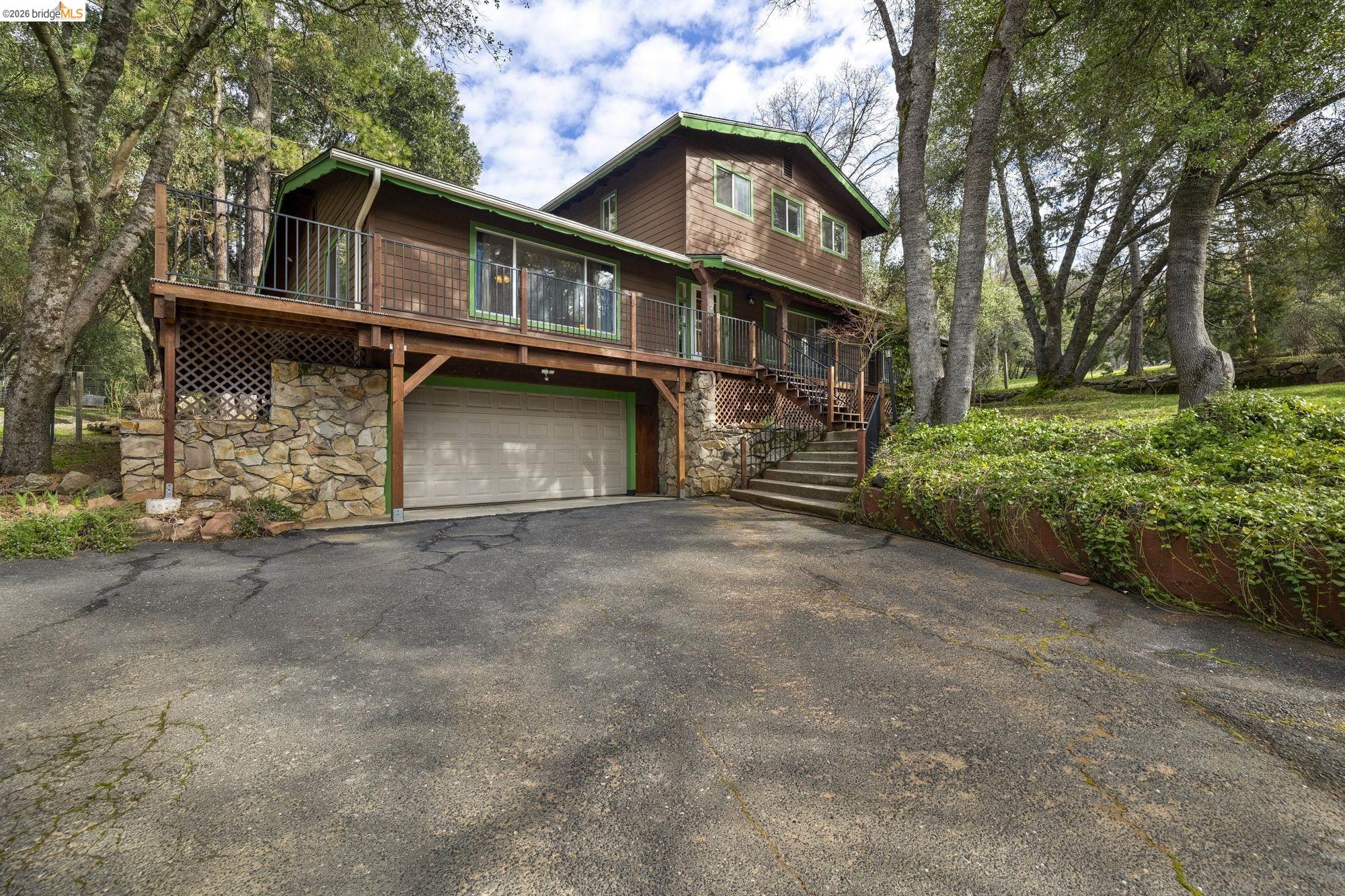 21550 Phoenix Lake Road Sonora, CA 95370 - Photo 31 of 50 a view of a house with a yard