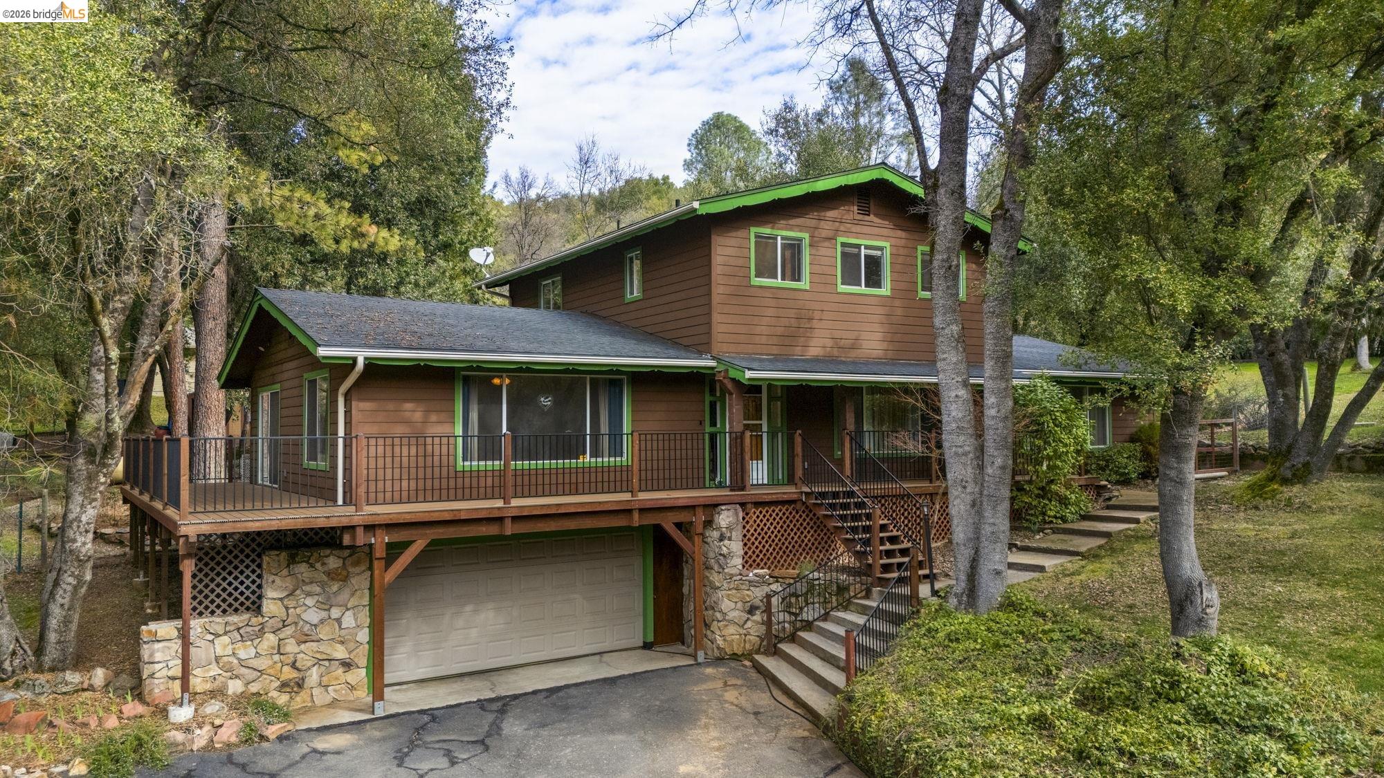 21550 Phoenix Lake Road Sonora, CA 95370 - Photo 42 of 50 a front view of a house with a yard