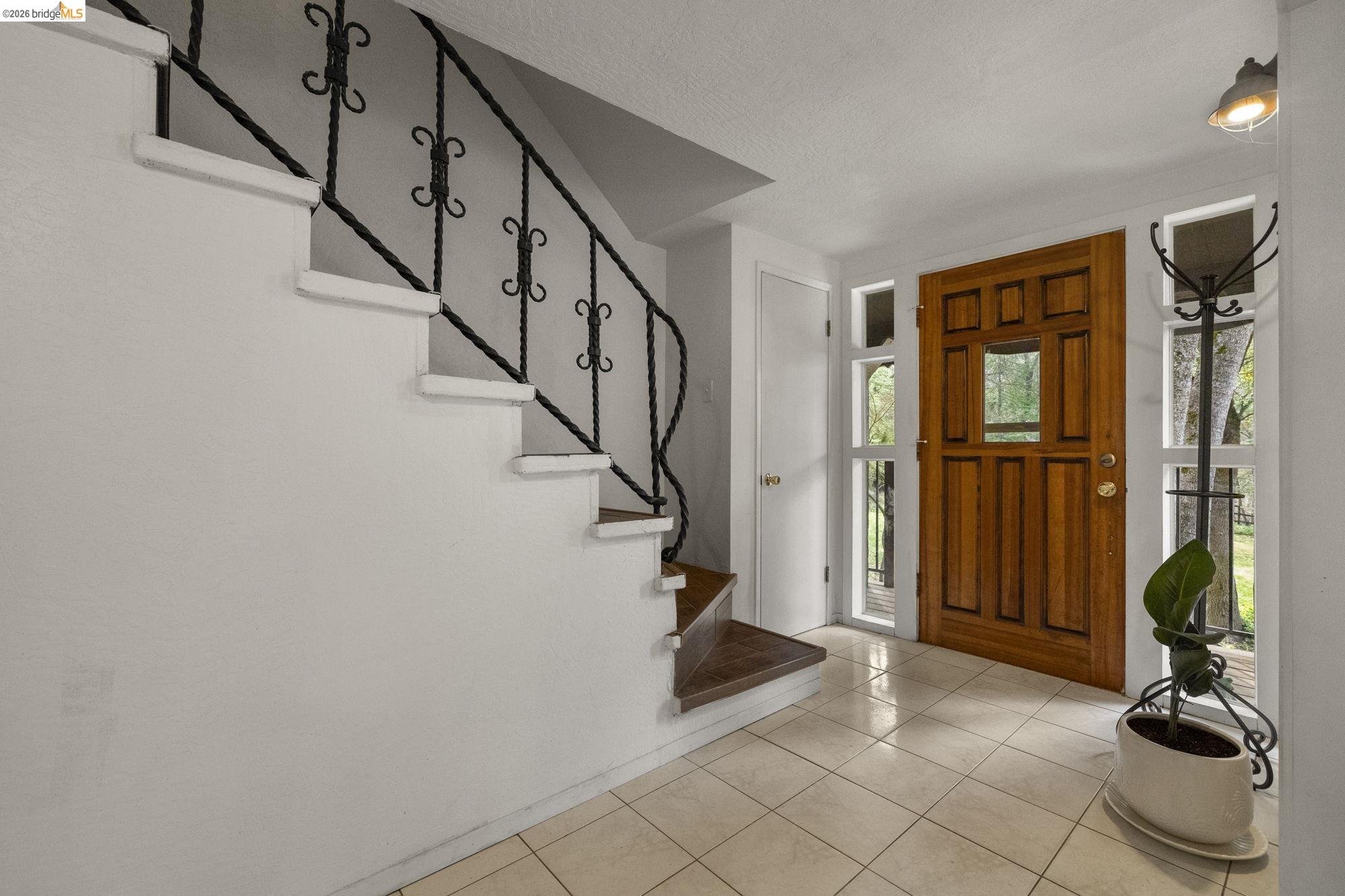 21550 Phoenix Lake Road Sonora, CA 95370 - Photo 7 of 50 a view of entryway with wooden floor and stairs