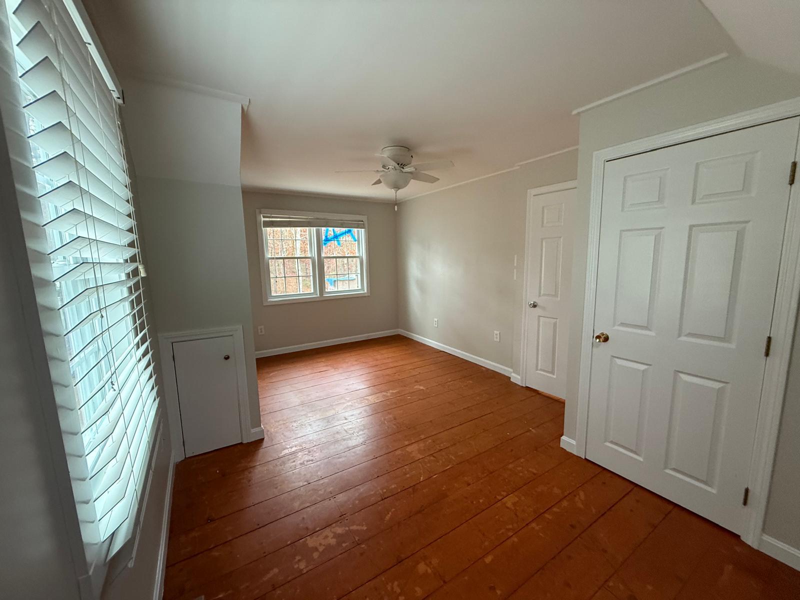 86 Lowell Road Mashpee, MA 02649 - Photo 15 of 18 wooden floor in an empty room with a window