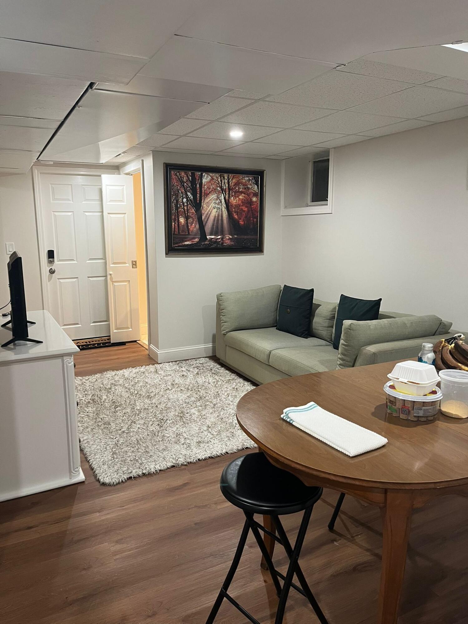 86 Lowell Road Mashpee, MA 02649 - Photo 2 of 18 a living room with furniture and a flat screen tv