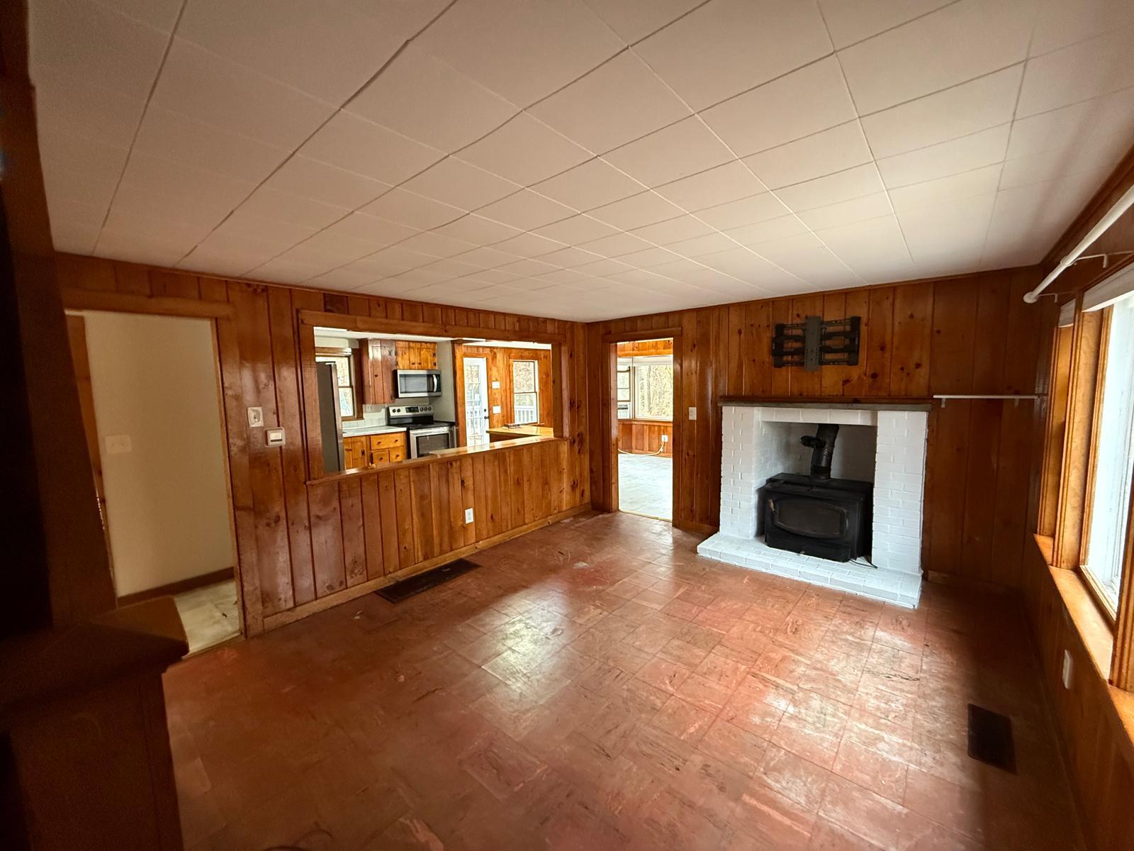 86 Lowell Road Mashpee, MA 02649 - Photo 6 of 18 a view of a livingroom with a fireplace