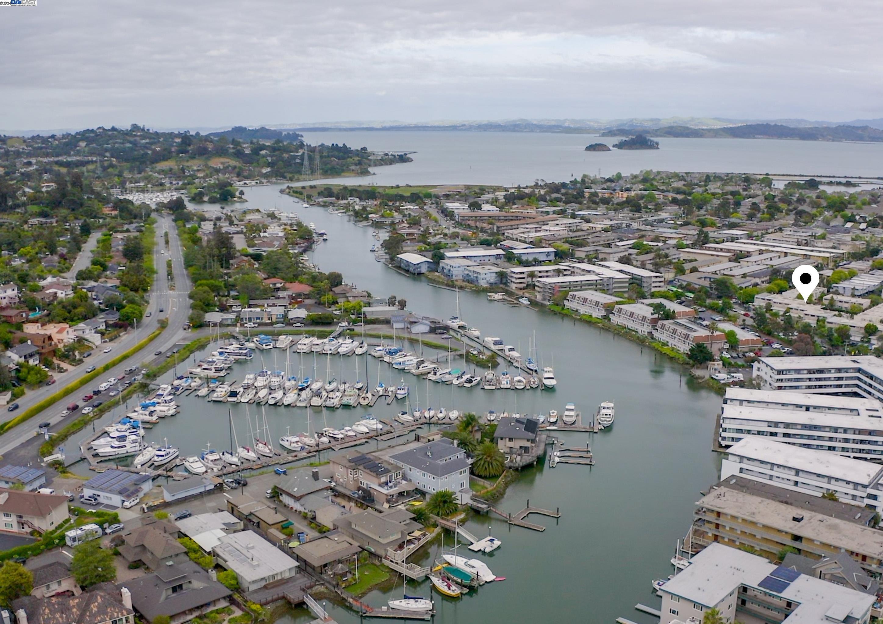 321 Canal Street San Rafael, CA 94901 - Photo 1 of 1 an aerial view of a city with lots of residential buildings ocean and mountain view in back