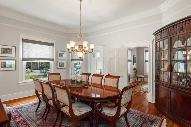 a view of a dining room with furniture window and wooden floor