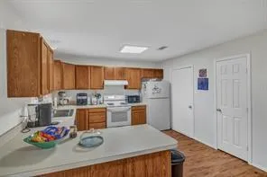 a kitchen with stainless steel appliances granite countertop a refrigerator and microwave