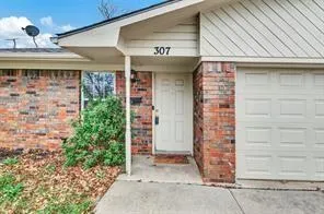a front view of a house with a garage