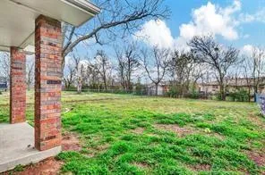 a view of a park with large trees