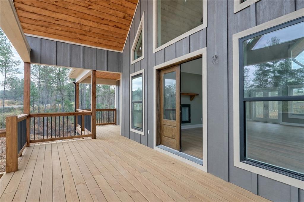 2956 Blalock Mountain Road Talking Rock, GA 30175 - Photo 10 of 65 a view of a balcony with wooden floor