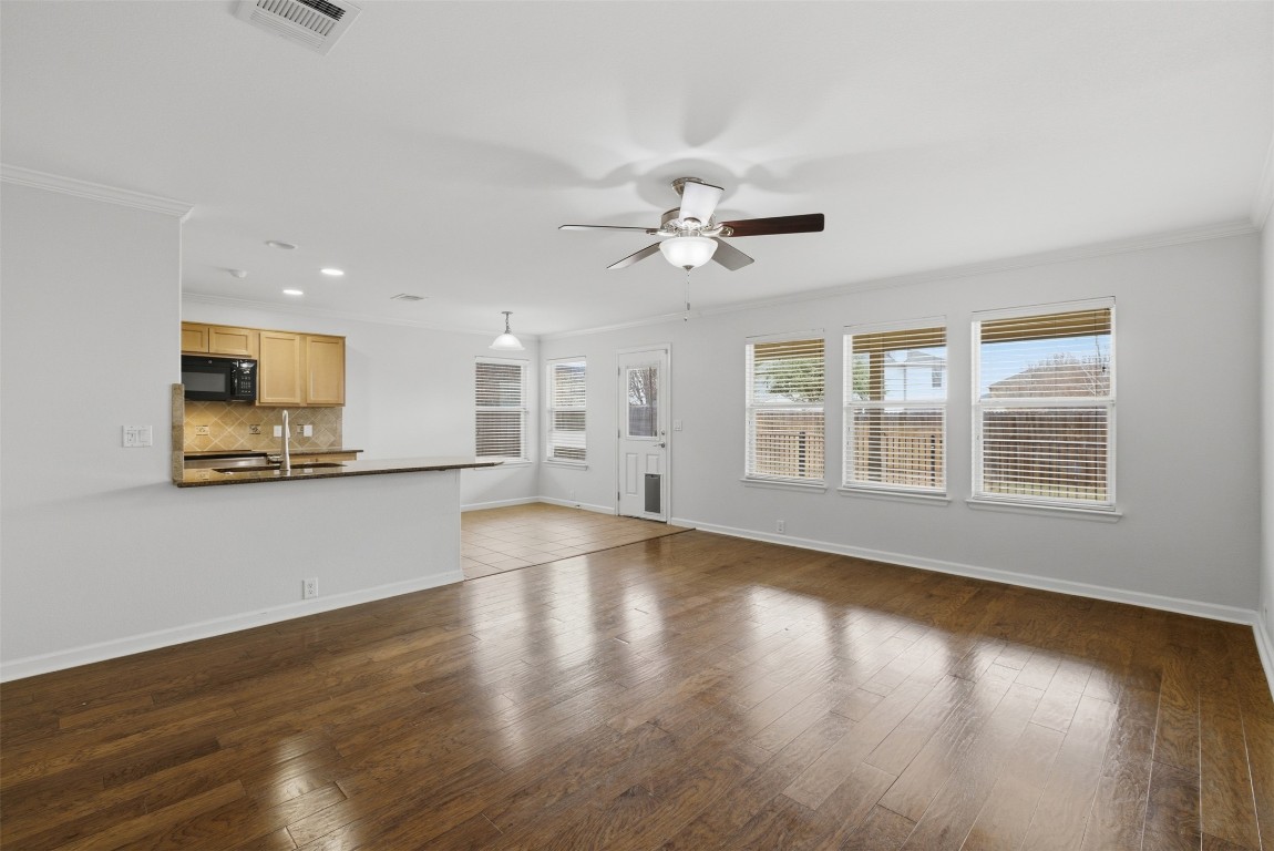 508 Lark Street Leander, TX 78641 - Photo 10 of 40 Another view of the family room down - light and bright, open to both kitchen and breakfast areas.