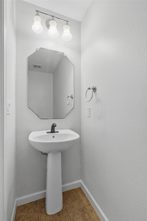 508 Lark Street Leander, TX 78641 - Photo 15 of 40 The half bath down is great for guests to use. Sink shown only in this photo, commode is unseen in photo.