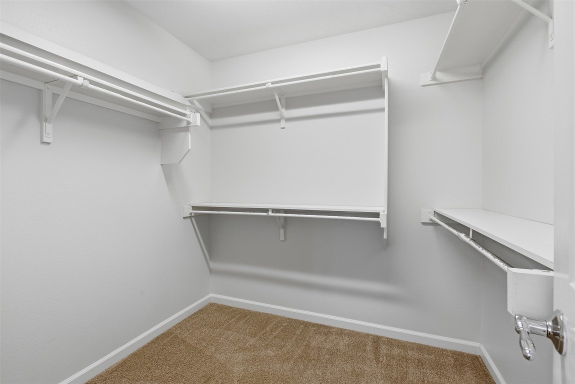 508 Lark Street Leander, TX 78641 - Photo 21 of 40 This is the primary bedroom's closet - smart design made to fit a lot.