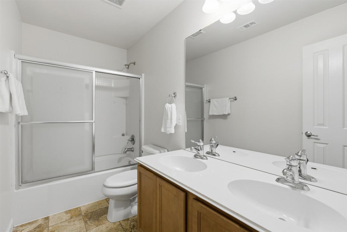 508 Lark Street Leander, TX 78641 - Photo 27 of 40 The secondary bathroom up with dual sinks is in great condition!