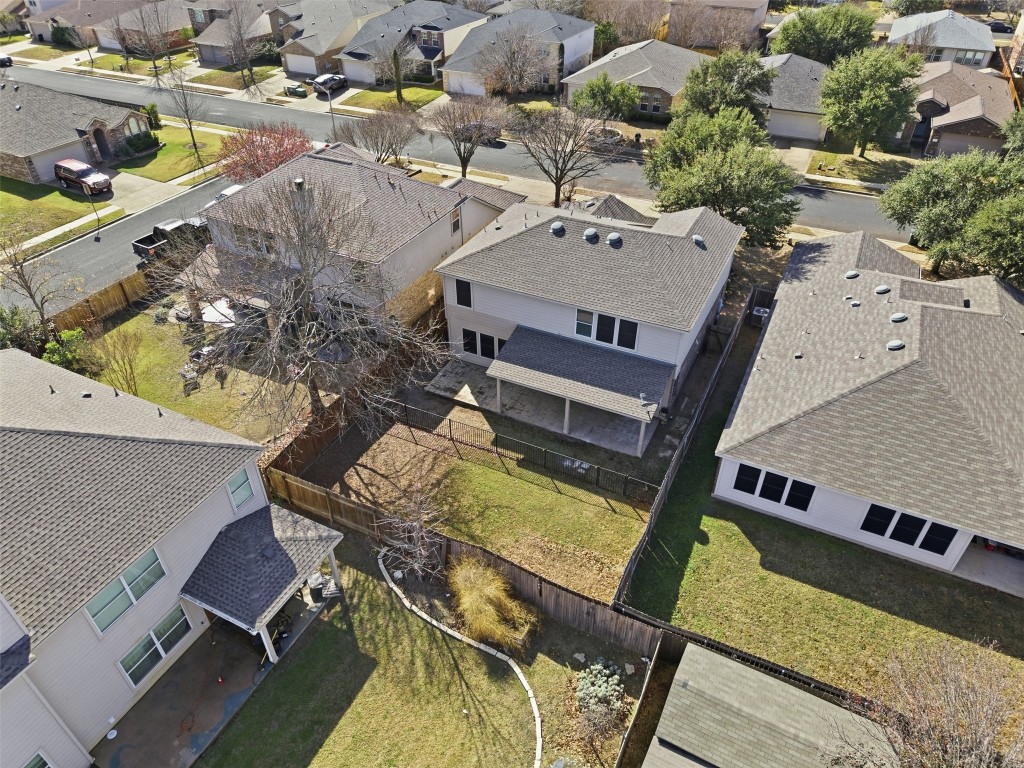 508 Lark Street Leander, TX 78641 - Photo 37 of 40 Aerial view of the rear of the home showing the covered porch and yard space.