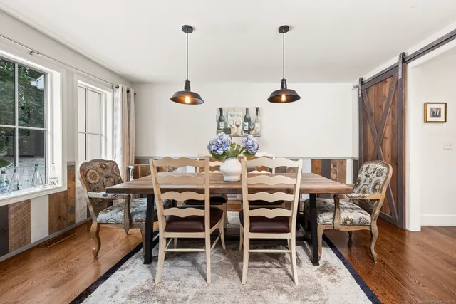a view of a dining room with furniture window and wooden floor
